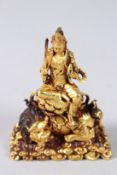 A TIBETAN GILT BRONZE 