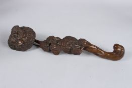 A CHINESE CARVED WOOD SCEPTRE. 13ins high.