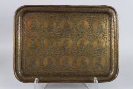 A 19TH CENTURY PERSIAN QAJAR ENGRAVED BRASS TRAY depicting Persian kings. 11ins x 15ins.