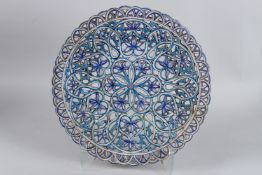 A VERY FINE AND LARGE 19TH CENTURY NORTH INDIAN MULTAN OPEN WORKED (JALI) GLAZED POTTERY CHARGER.