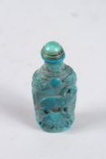 A CARVED TURQUOISE CHINESE SCENT BOTTLE AND STOPPER.