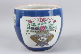 A CHINESE BLUE GROUND CIRCULAR JARDINIERE painted with panels of figures and emblems. 9.5ins