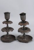 A PAIR OF 19TH CENTURY ISLAMIC INDIAN KASHMIRI CANDLESTICKS. 9ins high.