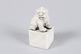 A CHINESE BLANC-DE-CHINE LION SEAL.