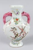 A CHINESE FAMILLE ROSE MOON FLASK painted with birds and flowers. 7.5ins high.