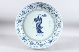 A GOOD LARGE CHINESE BLUE AND WHITE DISH, the centre painted with figures and calligraphy. 16ins