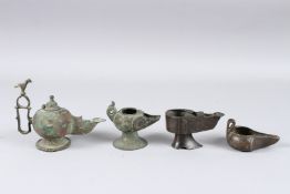A COLLECTION OF FOUR 12TH - 13TH CENTURY PERSIAN OF CENTRAL ASIAN KHURASAN BRONZE OIL LAMPS. 2.