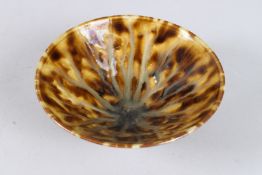 A CHINESE SPECKLED BROWN CIRCULAR BOWL. 6ins diameter.