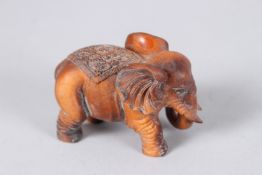 A CARVED WOOD ELEPHANT. 2.5ins.