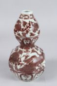 A CHINESE OCTAGONAL VASE with birds and fruiting vines. 9ins high.