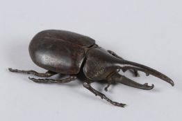 A JAPANESE OKIMONO BRONZE EASTERN HERCULES BEETLE.