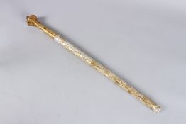 A VERY GOOD INDIAN MOTHER-OF-PEARL STAFF with ornate gilt handle. 24ins long.