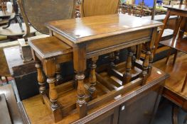 An oak nest of tables.