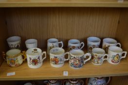 A quantity of Victorian and later Coronation mugs and beakers.