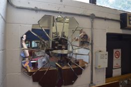 A decorative sunburst style wall mirror.