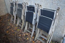 A set of eight folding garden chairs.