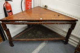 A Chinese inlaid hardwood corner table with pierced and carved undertier.