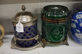 Two cut glass tobacco or biscuit jars with plated mounts.