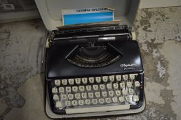 A cased portable typewriter.