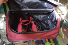 A holdall containing bowling woods.