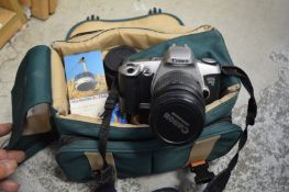 A Canon camera outfit with bag.