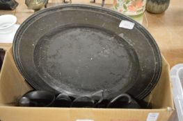 A large 19th century pewter dish and similar items.