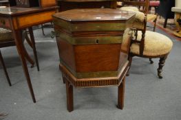 A brass bound mahogany hexagonal shaped cellarette.