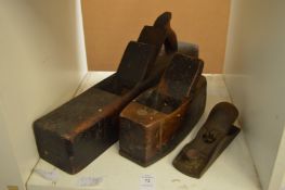 Three wood working planes.