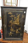 A 19th century chinoiserie decorated hanging corner cabinet.