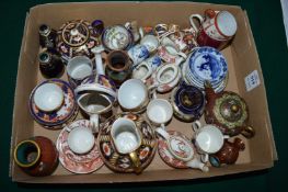 A collection of miniature porcelain to include Royal Crown Derby etc.