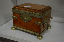 A small metal bound oak casket.