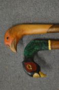 Two birds head walking sticks.