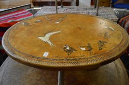 Workshop Wales, Fishguard, an oval coffee table, the embossed leather top depicting various birds.