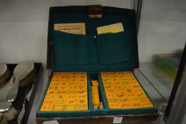 Leather cased mahjong set.