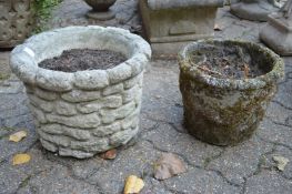 Two reconstituted stone garden plant pots.