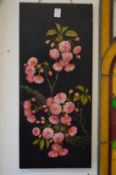 A pair of early 20th century Japanese black lacquer panels, each painted with cherry trees and