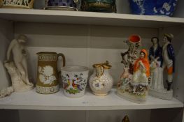 A shelf of decorative china.