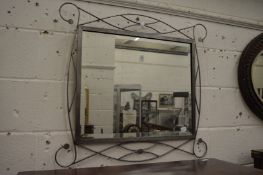 A modern metal framed mirror.