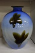 Japanese porcelain vase painted with leaves.