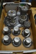 Pewter items to include a set of six Italian pewter cups and saucers, a hammered pewter tea