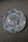 A Japanese blue and white circular porcelain dish.