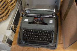 An Olympia portable typewriter.