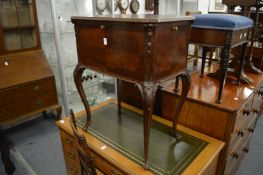 A small mahogany free standing drop-flap drinks cabinet.