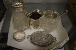 Silver milk jug and other items.