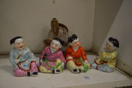 A group of seated Chinese figures.