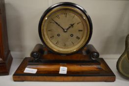 A walnut cased drum head mantel clock.