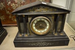 A Victorian slate mantel clock.