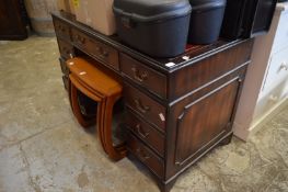 A reproduction mahogany pedestal desk.