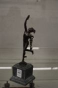 A small bronze of Mercury on a square shaped marble base.