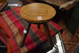 Workshop Wales, Fishguard, a small three legged stool with embossed leather top.